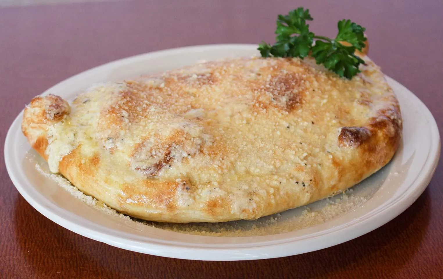 A golden baked calzone from Maestro's