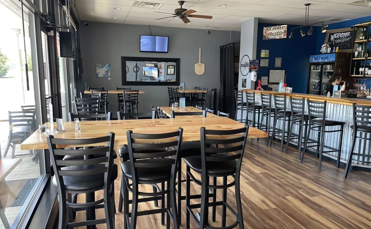 Tables and the bar at Maestro’s Pizza